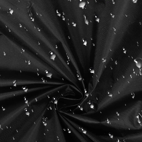 Close-up of heavy duty black fabric with water droplets, highlighting waterproof quality for Heavy Duty Outdoor EV Charger Post Cover With Kickass Waterproof And Dustproof Shell For Secure Universal Fit And All Season Protection That Just Goes The Distance On Your Electric Car.