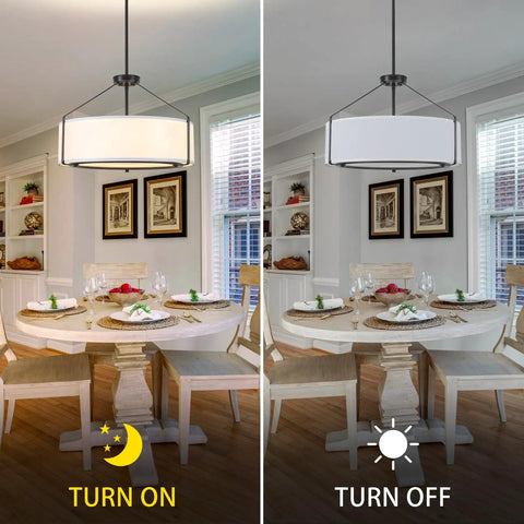 Grab This 20 Inch Drum Chandelier With 5 Lights For Instant Modern Farmhouse Vibes Featuring Soft White Linen Shades And Sleek Black Frames, on and off settings over dining table.