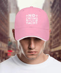 Pink breathable cap with six vent eyelets low profile unstructured hat for women and men, front view, street background