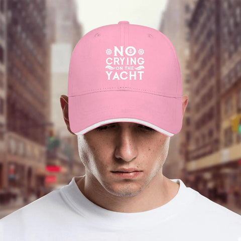 Pink breathable cap with six vent eyelets low profile unstructured hat for women and men, front view, street background