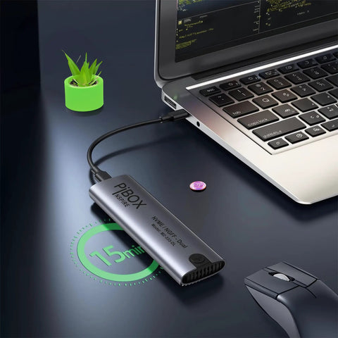Hassle Free Nvme M2 Enclosure For Usb 3.2 Drives connected to a laptop on a desk with a plant nearby.