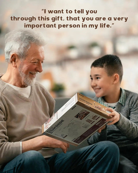 Boy giving Electric Vintage Steam Engine 3D Puzzle Kit For Adults 469 Piece Mechanical Wooden Model to an elderly man.