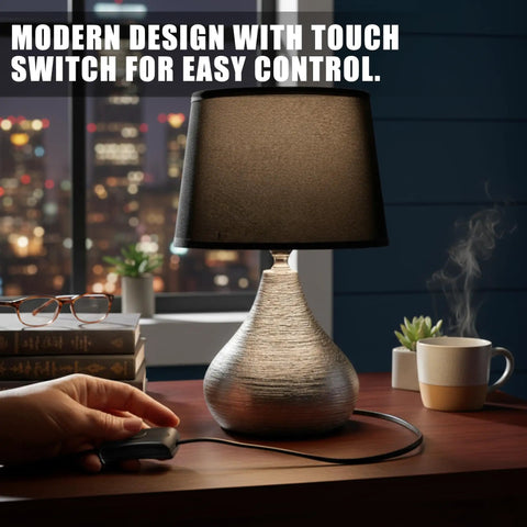 Person using Two Pack Black Thumb Control Inline Power Button Switches For Lamps And Small Devices, Dual Pole AC Switch Supports 12V To 250V Up To 2A, Quick Wire Connect, Safe Housing For DIY Light Fix next to a modern lamp on a table.