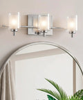 Kolt Modern Vanity Bath Lighting 3 Light LED Fixture In Polished Chrome above round mirror in bathroom