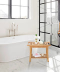 Must Have 100 Percent Bamboo Shower Bench With Storage Shelf, 24 Inch Waterproof Shower Chair next to bathtub.