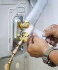 Applying Pipe Wrapping Tape 4.7 Inch by 49.2 Feet, PVC Duct Tape on air conditioner piping for waterproof insulation.