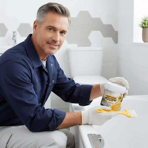 Man applying Heavy Duty Roof Sealant Waterproof Invisible Coating in a bathroom, showcasing its use on leaks.