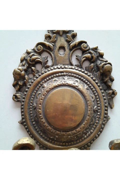 Close-up of Robust Vintage Brass Wall Hook With Classic Old School Charm And Hella Tough Build For Entryway Or Bathroom Decor.