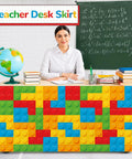 9 Foot Building Block Table Skirt Bringing Sweet Brick Vibes To Teachers Desks And Classroom Workstations For Back To School Setup And Quick Office Or Cabinet Decor Accents, colorful design on a teacher's desk.
