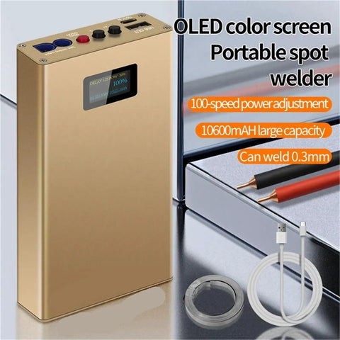 Portable Handheld Spot Welder With Color Screen rechargeable mini welding machine, compact design with accessories, on a table.