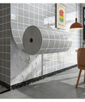 Peel And Stick White Brick Wallpaper 3D Wall Covering With Slick XPE Backing For A Zero Sweat Install visible on rolled tube.