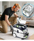 Man using Five Pack Dust Filter Bags Compatible With CT26 CT26E CT36 CT36E Vacuum Cleaners in living room