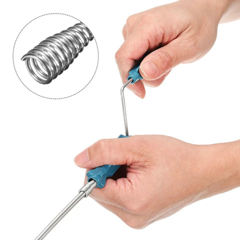 Hands using Heavy Duty 6 Ft Stainless Steel Drain Auger Snake for clogs with flexible claw grabbing debris.