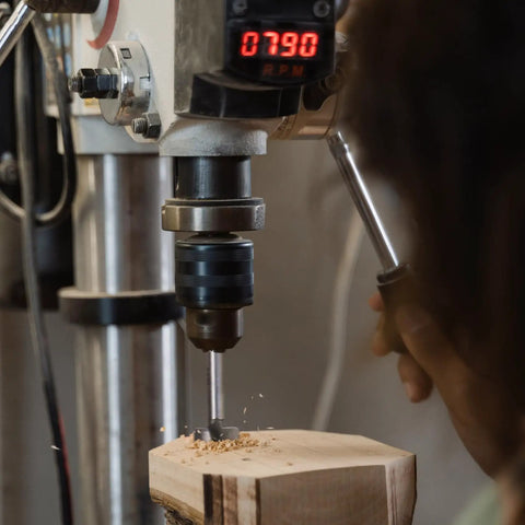 Top Tier 21 Piece Forstner Bit Set Made For No Sweat Drilling On Any Project With Carbide Tipped Wood Drill Bits Covering Metric Sizes 10 To 42 Mm round shank in use with drill bit on wood.