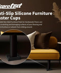 Black rectangle rubber caster cup 2.9 x 2.3 inches under sofa leg on hardwood floor, part of 8-pack anti-slip furniture pads.
