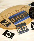 Interlocking Router Letter Templates For Custom Wooden Signs In Comic Sans Font 2-1/4 Inch Height with cut letters on wood.