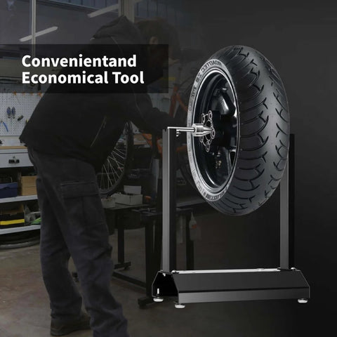 Beefy Motorcycle Wheel Balancer Stand For Static And Dynamic Tire Balancing On Most Motorcycles Off Road And Sport Bikes With A Chrome Plated Balance Bar And Rust Resistant Powder Coated Iron Construction in a garage setting