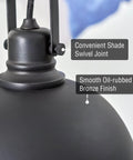 Close-up of Modern Retro Pendant Light with dome shade in oil-rubbed bronze finish, showing swivel joint for sloped ceilings.
