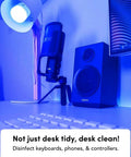 Wi-Fi Smart LED Light Bulb 1100 Lumens, Full RGBW Color illuminating a desk setup with speaker and microphone, HEV Antibacterial Mode