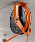 Pro Level Retractable Air Hose Reel Including 3/4 Inch By 50 Foot Pvc Hose With Snappy Auto Rewind and wall mount with orange hose.