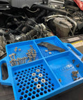 Blue Silicone Fastener Tray For Bolts, Nuts, And Bits With Handy Handle in automotive repair setting