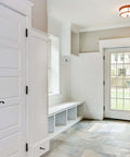Entryway with installed Black 4 Inch Self Closing Door Hinges, Five Eighths Inch Radius Corners, Heavy Duty Spring Hinge on white door