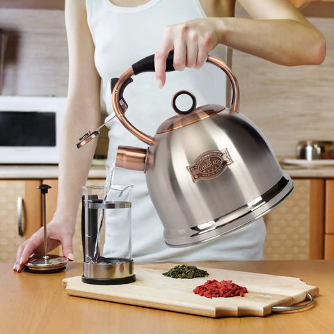 Stainless Steel Whistling Tea Kettle for Stovetop, Food Grade Build with a Thick 5 Layer Bottom, 3 Quart Capacity, in kitchen setting.