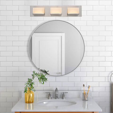 Everett 24 Inch Modern 3 Light Integrated LED Vanity Light With Brushed Nickel Finish over bathroom mirror.