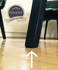 Hella Durable Self Adhesive Felt Pads Black Round Furniture Glides on black chair leg protecting wooden floor