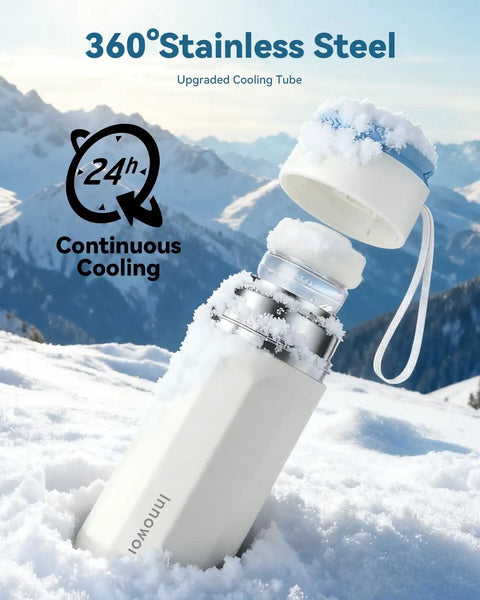No Mess Hassle On The Fly Breast Milk Cooler in snow, showcasing 11 oz stainless steel bottle with cooling tube.