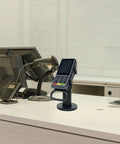 Adjustable Credit Card Reader Bracket With 180 Degree Rotation And 90 Degree Tilt, mounted at a cashier station