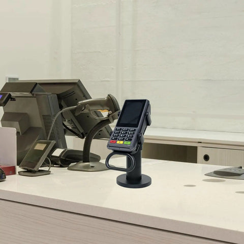 Adjustable Credit Card Reader Bracket With 180 Degree Rotation And 90 Degree Tilt, mounted at a cashier station