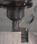 Carbide Square End Mill 4 Flute Diameter One Sixteenth Inch, Cutting Length Three Sixteenth Inch, in use on steel block
