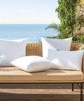Pack Of 2 18x18 Outdoor Pillow Inserts, Waterproof And Water-Resistant Cushions on wicker couch by seaside
