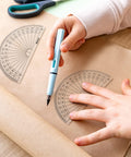 Bulk 100 Pack Clear Plastic Protractors 4 Inch Transparent Geometry Measuring Tools in use for math projects.
