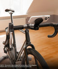 MagSafe Phone Mount Adapter For Indoor Spin Sessions Compatible With Wahoo Bike Mount, attached to bike handlebars