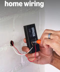 Installing Top Shelf Hardwired Video Doorbell Camera with existing home wiring and screwdriver in hand.