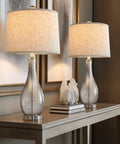 24.5 Inch Glass Table Lamps Set Of 2 With USB Charging Ports on wooden console, modern silver finish, fabric shade