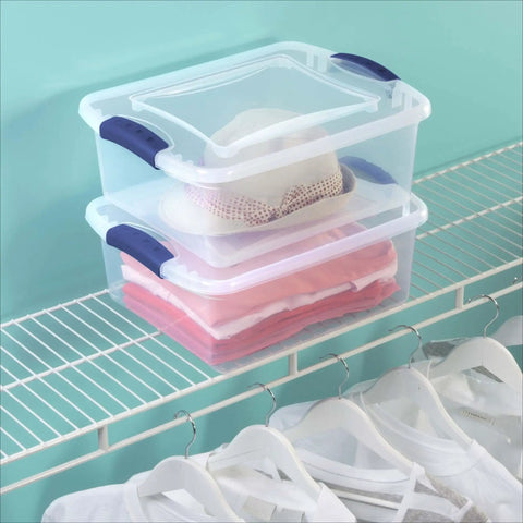 Four Pack 15 Quart Storage Bins With Hella Sturdy Snap Tops And Crystal Clear Lids Stackable Plastic Totes storing clothes and a hat on a shelf.