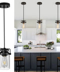 Farmhouse Vibe 5 Light Pendant Light for Kitchen Island, black finish, clear glass shades shown above modern kitchen counter.