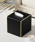 Black Square PU Leather Tissue Box Cover With Gold Tone Edging Luxury Vibe For Living Room Bedroom Bathroom Desk Or Office Coffee Table Decor That Feels Boss Level Dope on a white coffee table.