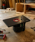 Rock Solid Router Table Insert Lift Plate With Bulletproof Stability And Dial In Height Control Heavy Duty Aluminum Alloy Mount for trim routers on workbench.