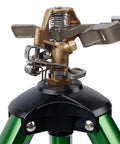 Close-up of Beefy Impact Sprinkler Head On Tripod Base For Lawn Irrigation, metal nozzle detail and solid alloy legs.