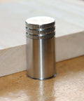 Close-up of 20mm stainless steel bench dog from set with rubber connector, for T-track workbenches and tables, rock solid hold