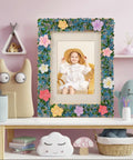 Mosaic Photo Frame Kit For Kids With Glass Pebbles, Hands On Arts And Crafts Activity displayed on a shelf with toys.