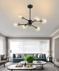 Six Light Sputnik Chandelier Pendant Light With 4.7 Inch Glass Globe Shades in modern living room with gray sofas