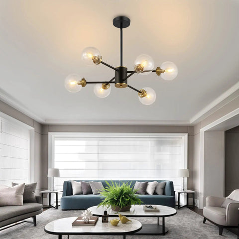 Six Light Sputnik Chandelier Pendant Light With 4.7 Inch Glass Globe Shades in modern living room with gray sofas