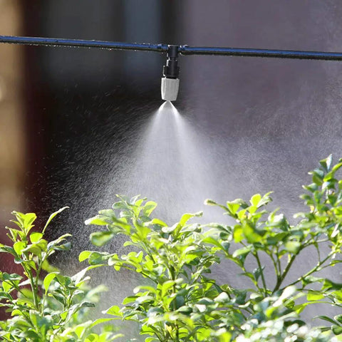 20 Piece Adjustable Sprinkler Drip Heads With Tee Joints Watering Mister System spraying over garden plants