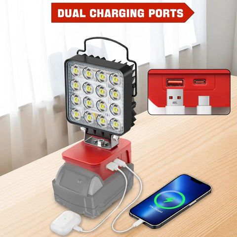 Cordless LED Work Light With 6000 Lumen Output And 38W Power, USB ports charging phone, red and gray design on table