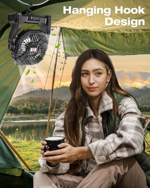 Portable Camping Fan With Led Lights And 20000mAh Battery hanging in tent with woman holding cup, outdoor setting, sunset view